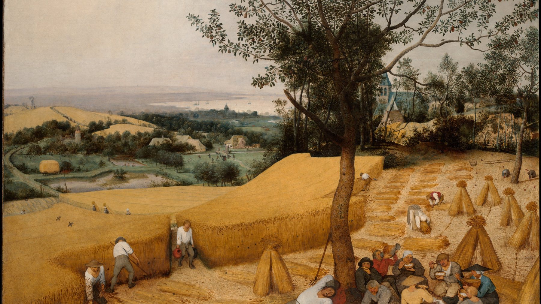 A sixteenth century painting of harvesters cutting and resting in a wheat field